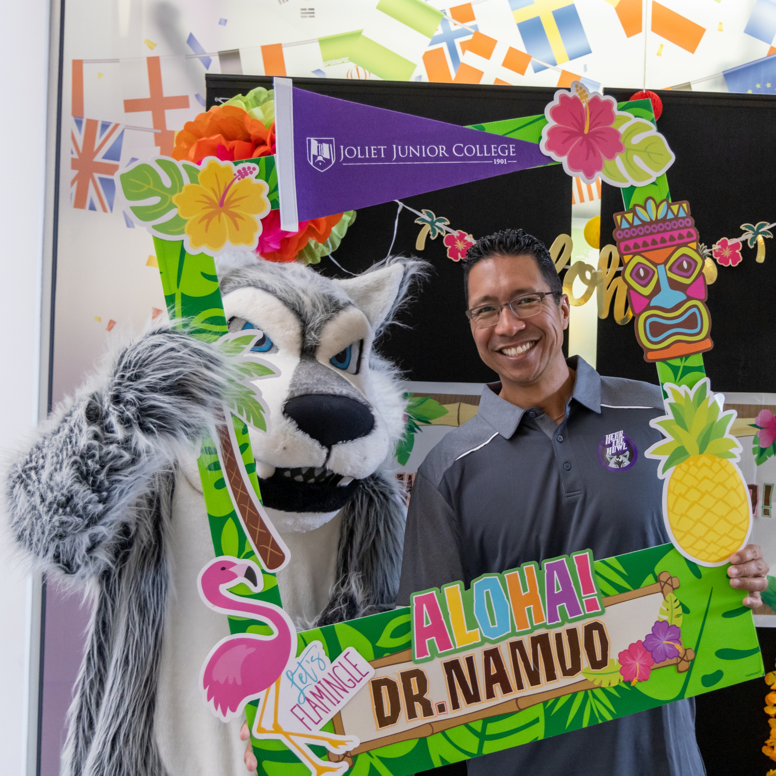 Dr. Namuo poses with Wiley the Wolf