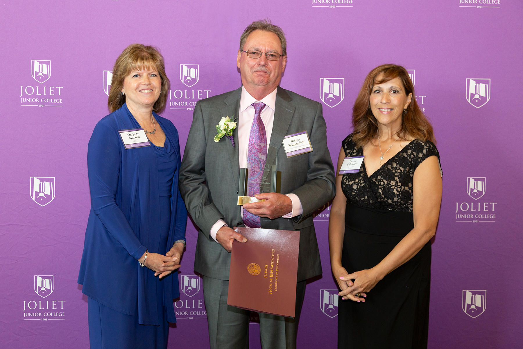 From left: JJC President Dr. Judy Mitchell, Robert Wunderlich (Susan H. Wood Hall of Fame Award recipient), JJC Alumni Board Member Luann Di Monte