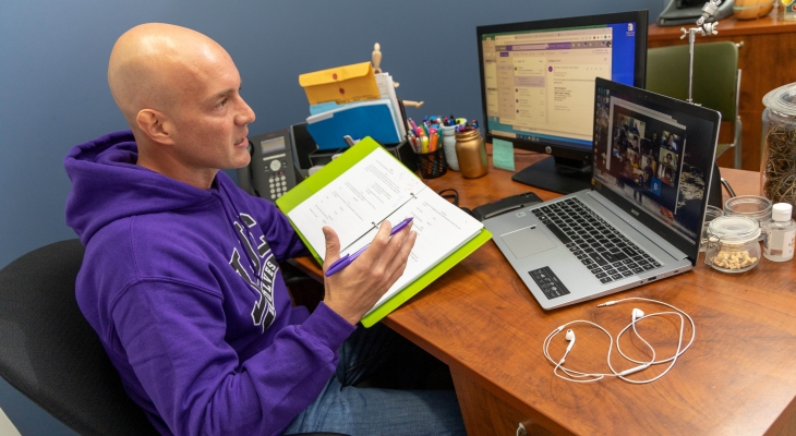 professor conducting a Zoom meeting